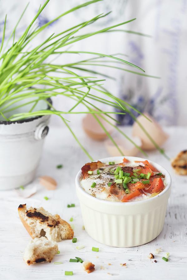 Baked Eggs With Bacon, Tomatoes And Chives Photograph by Malgorzata Laniak