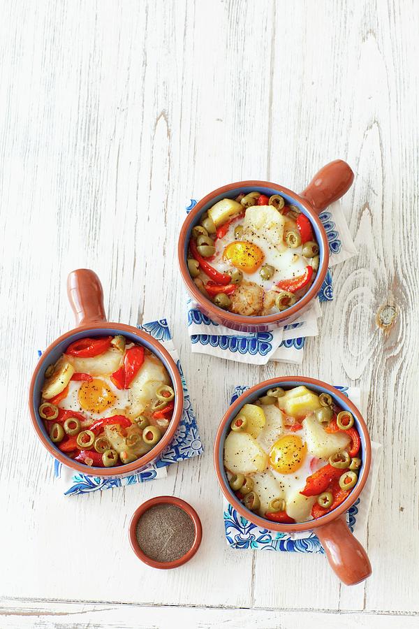 Baked Eggs With Potatoes, Peppers, Onions, Olives And Tomatoes Photograph by Rua Castilho