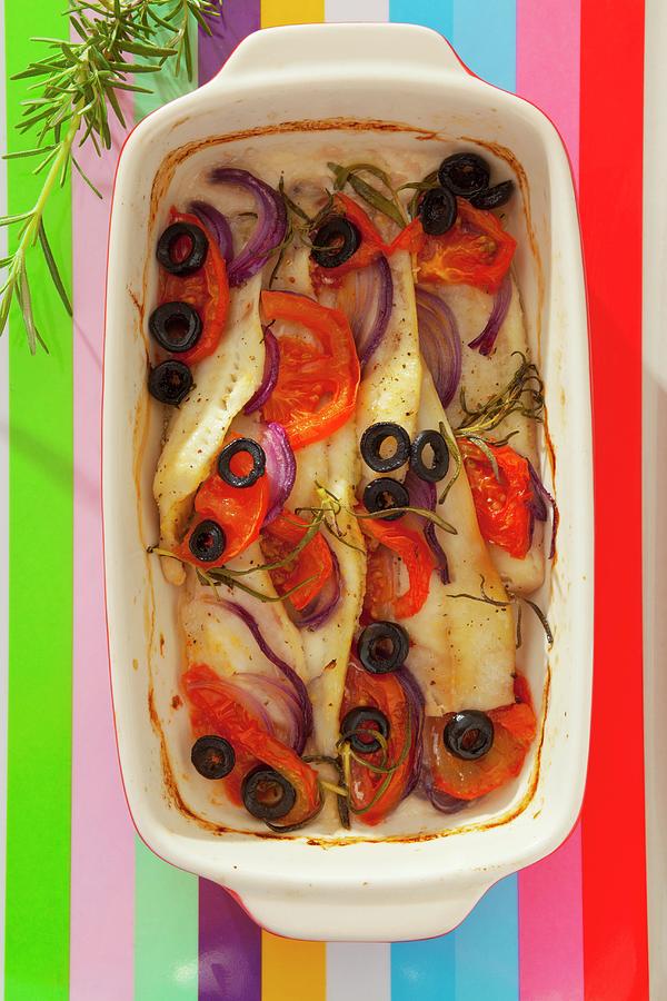 Baked Fillet Of Fish With Red Onions, Tomatoes, Black Olives And Rosemary Photograph by Studio Lipov