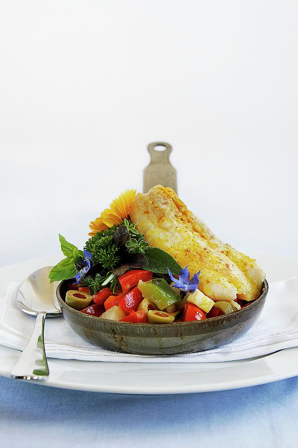 Baked Fish Fillet Served With Vegetables In A Small Pan Photograph by The Food Union