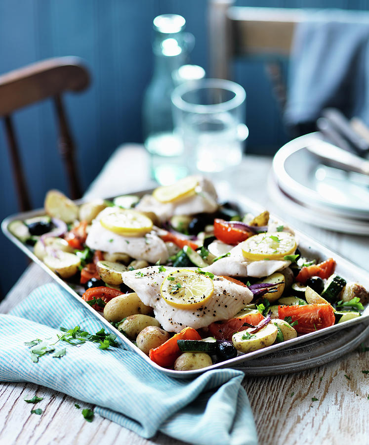 Baked Fish With Potatoes, Vegetables And Lemon Photograph by Karen Thomas