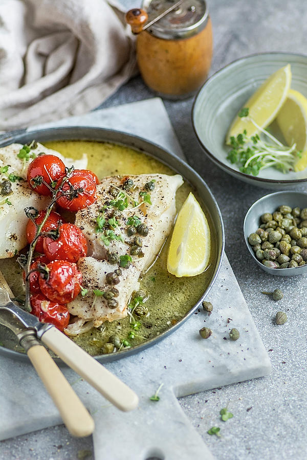 Baked Haddock With Tomatoes And Capers Photograph by Olimpia Davies