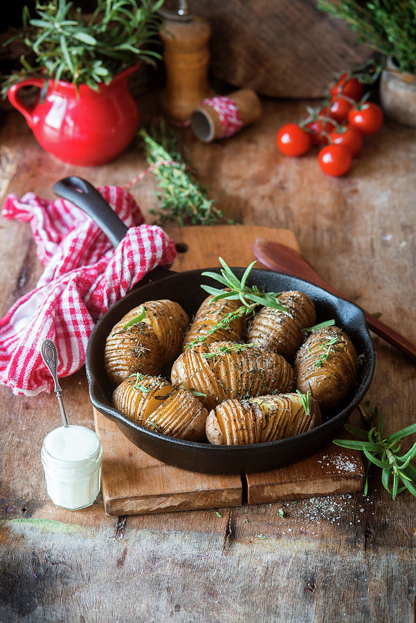 Baked Hasselback Potatoes With Herbs Photograph by Irina Meliukh