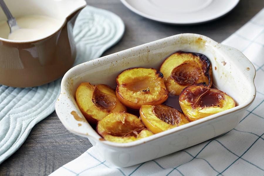 Baked Nectarines With Cream Photograph by Debby Lewis-harrison