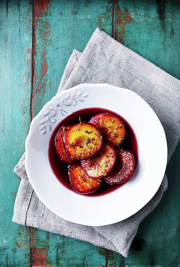 Baked Plums With Spices In A Red Wine Sauce Photograph by B.&.e.dudzinski