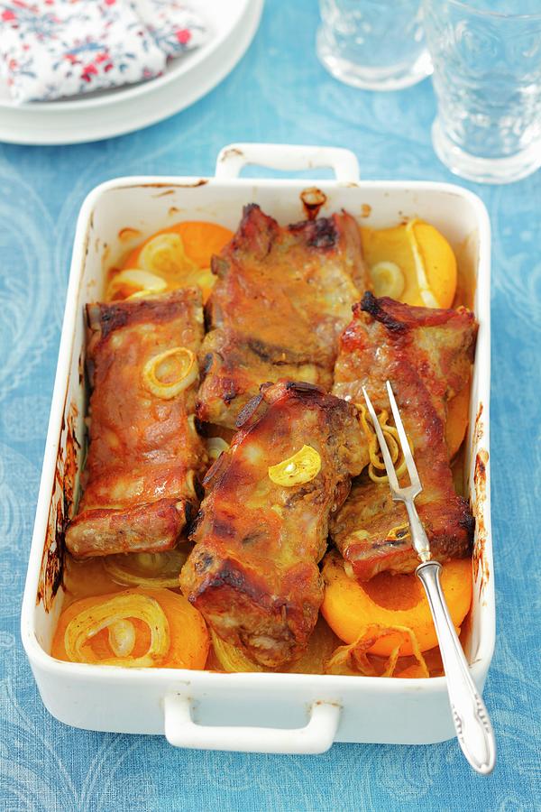 Baked Pork Ribs With Onions, Curry Powder And Peaches Photograph by Rua Castilho