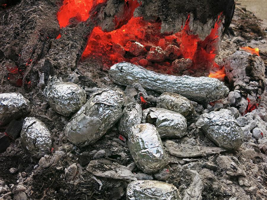 Baked Potatoes In The Embers Of A Campfire Photograph by Petr Gross