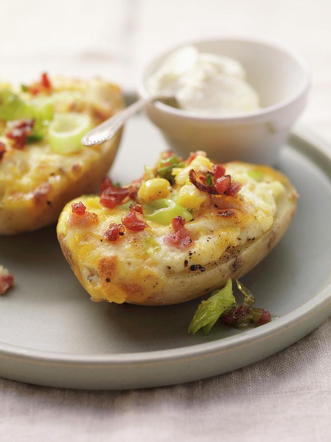 Baked Potatoes Topped With Cheese, Bacon And Sweetcorn Photograph by Eising Studio - Food Photo & Video