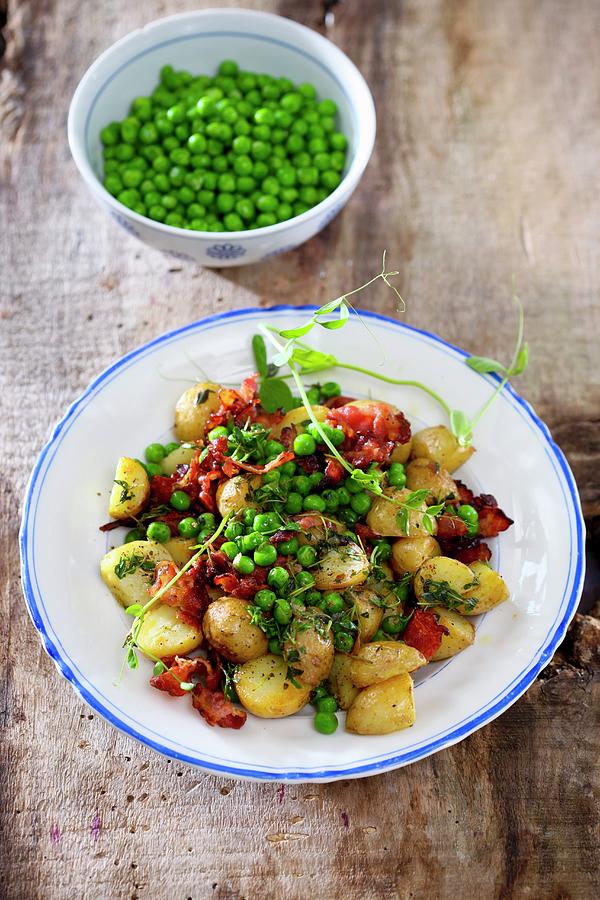 Baked Potatoes With Bacon And Peas Photograph by Boguslaw Bialy