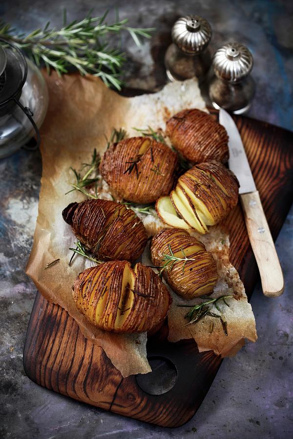 Baked Potatoes With Rosemary Photograph by Boguslaw Bialy