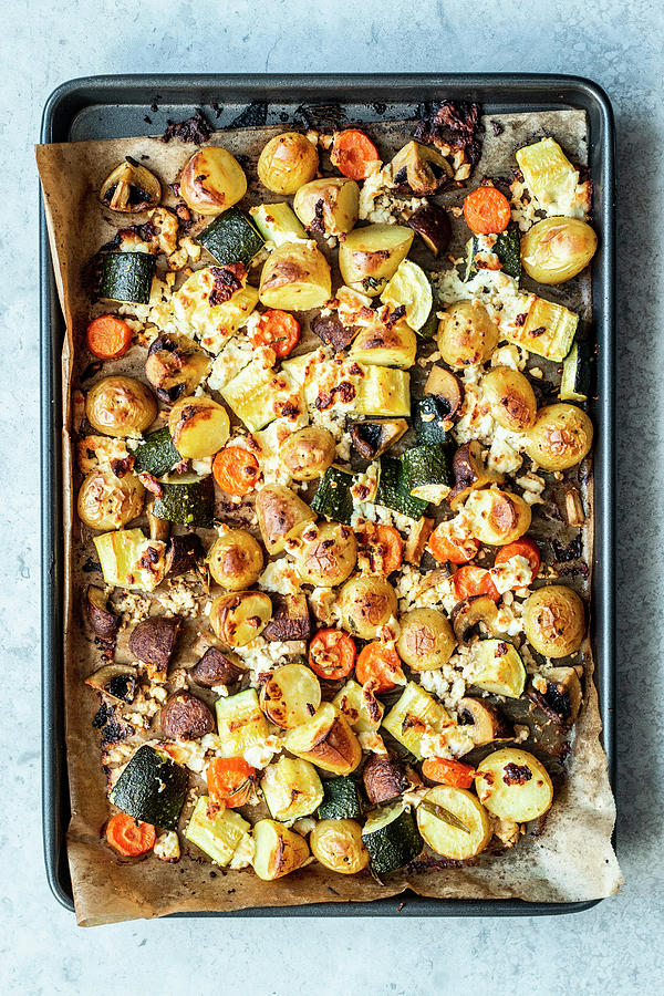 Baked Potatoes With Vegetables And Feta Cheese Photograph by Simone Neufing