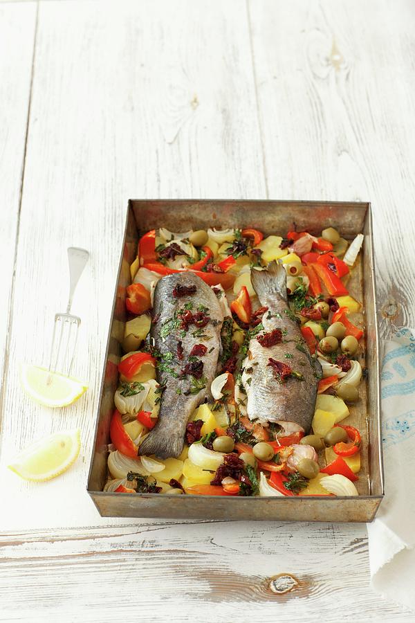 Baked Trout With Herbs, Butter And Vegetables On A Baking Tray Photograph by Rua Castilho