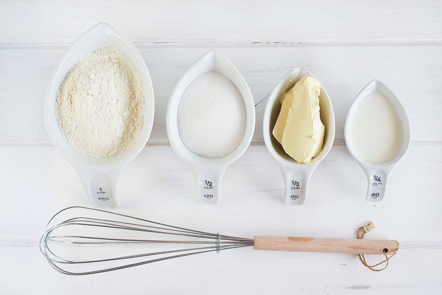 Baking Ingredients; Bowl Of Flour; Eggs; Whisk Photograph by Sonia Chatelain