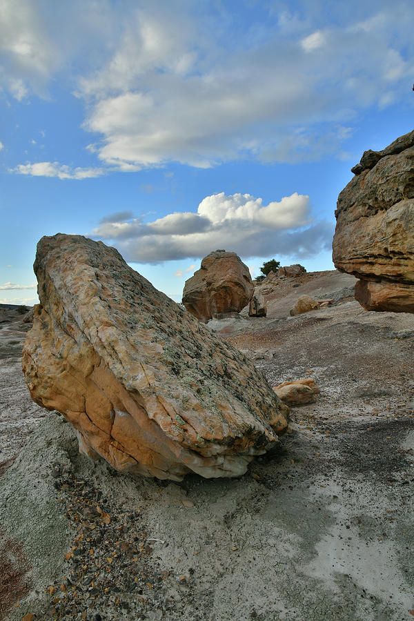 Balanced Boulders under Evening Clouds at Bentonite Site Photograph by Ray Mathis