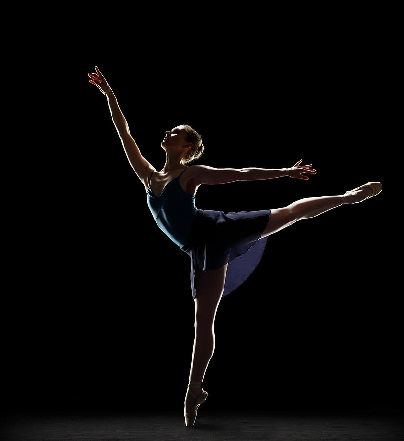 Ballerina In Arabesque Position Photograph by Lewis Mulatero