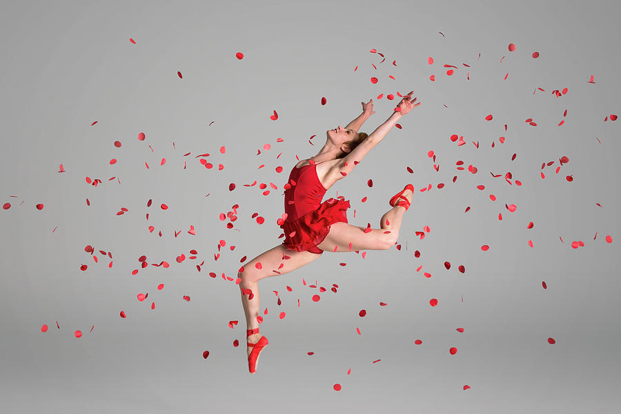 Ballerina Jumping Through Red Flowers Photograph by Nisian Hughes
