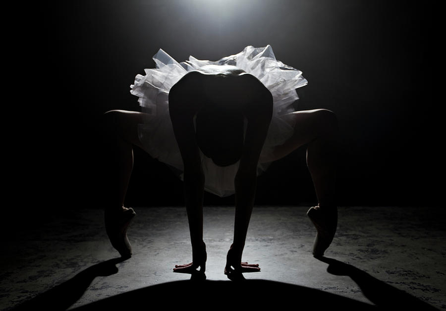 Ballerina Stretching On Stage Under Photograph by Nisian Hughes