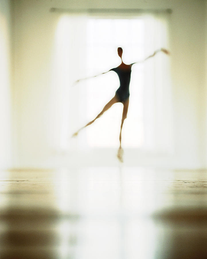 Ballet Dancer Practicing Infront Of Photograph by Devon Strong