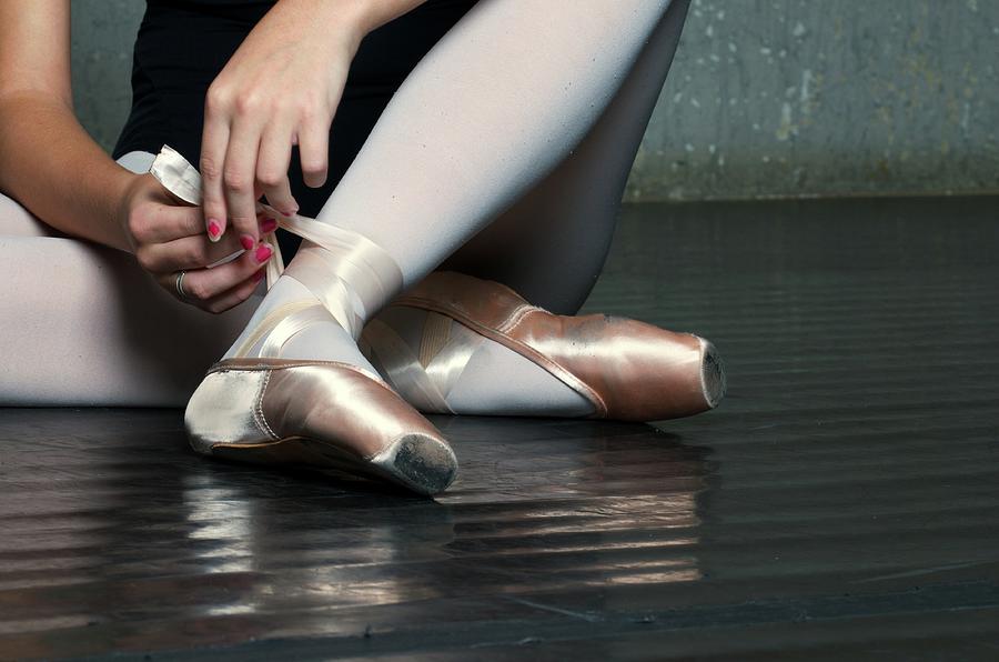 Ballet Dancer Tying On Slippers Photograph by Dlewis33