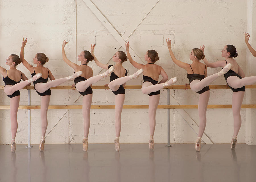 Ballet Dancers Standing On Toes In Photograph by David Fischer