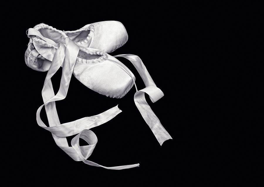 Ballet Shoes On Black Background Photograph by Vasiliki