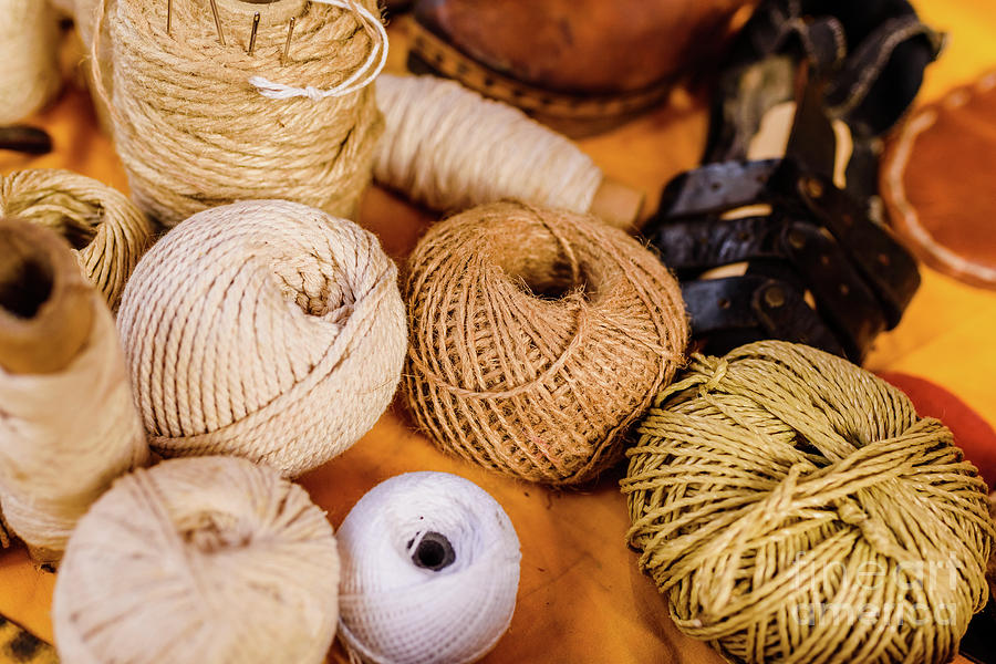 Balls of yarn, wool and rope of earth colors. Photograph by Joaquin Corbalan