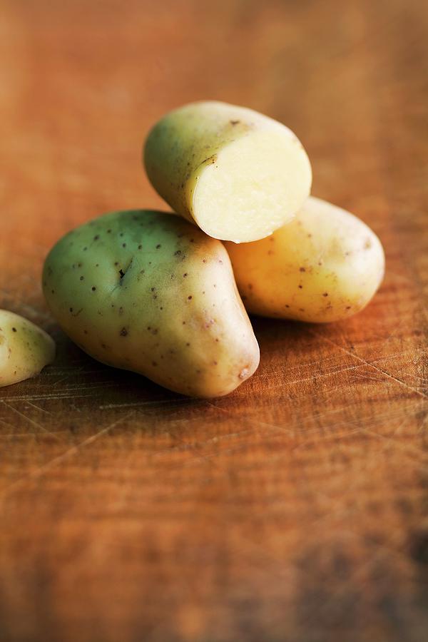 Balmoral Potatoes On A Wooden Surface Photograph by Michael Wissing