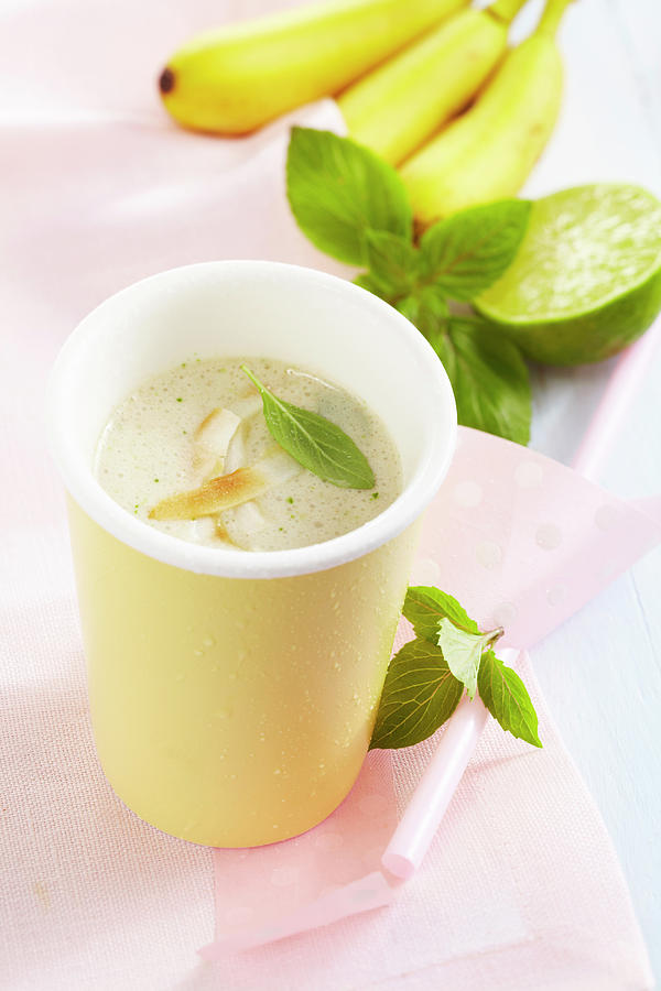 Banana And Coconut Smoothie With Thai Basil, Cinnamon, Cardamom And Syrup Photograph by Teubner Foodfoto