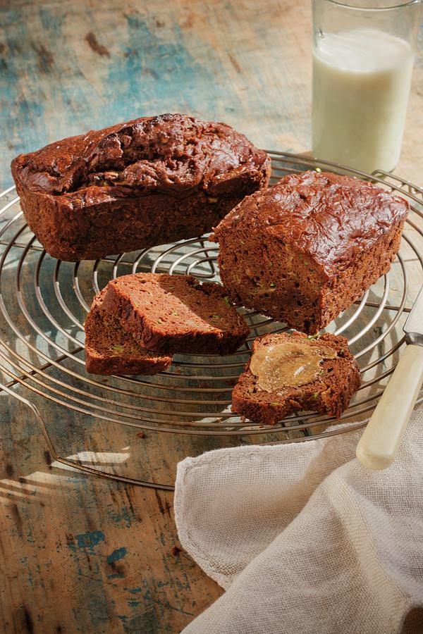 Banana Bread, Whole And Sliced On A Cooling Rack Photograph by Colin Cooke