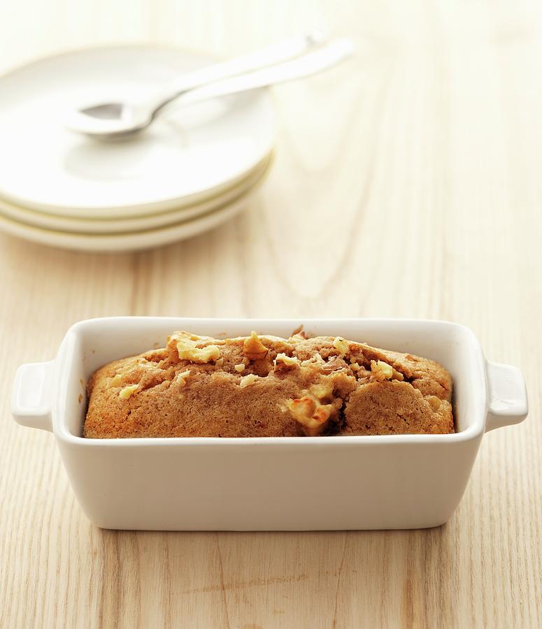 Banana Cake With Pecan Nuts In A Porcelain Baking Dish Photograph by Atelier Mai 98