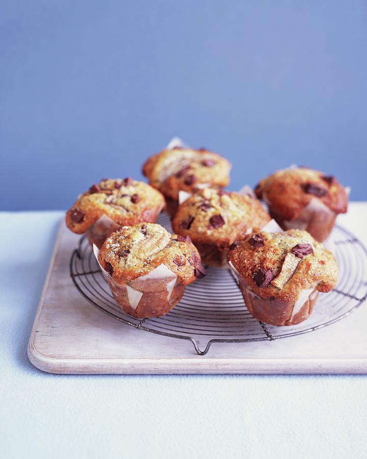 Banana Chocolate Muffins On A Wire Rack Photograph by Jonathan Gregson