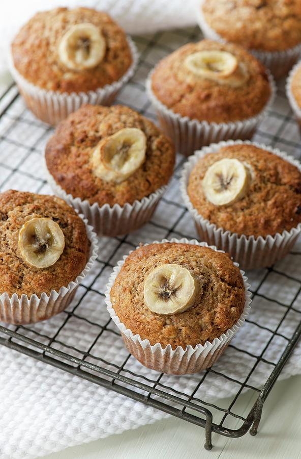Banana Muffins On A Cooling Rack Photograph by Jonathan Short