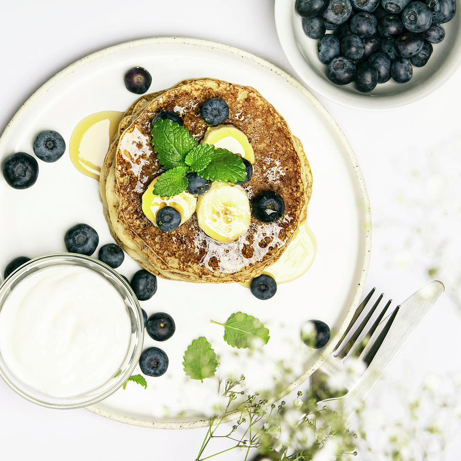 Banana Oat Pancakes With Fruits, Berries And Maple Syrup Photograph by Natalia Klenova