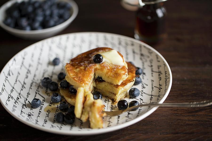 Banana Pancakes With Blueberries And Maple Syrup Photograph by Nicole Godt