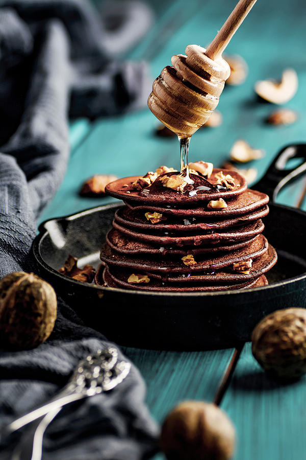 Banana Pancakes With Cocoa, Topped With Walnuts And Honey Photograph by Mateusz Siuta
