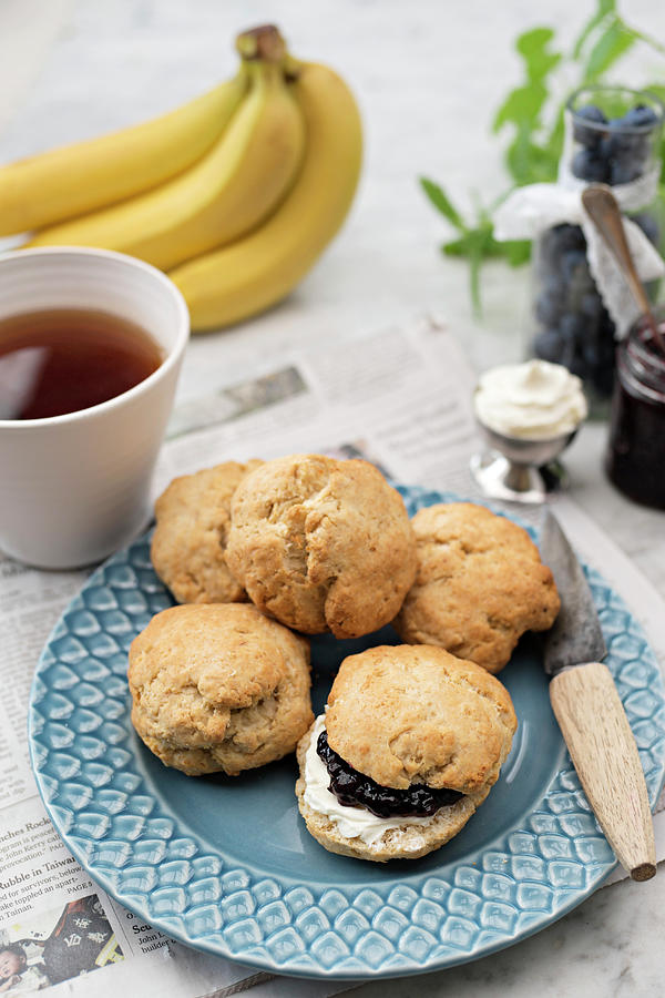 Banana Scones With Blueberry Jam And Cream For Teatime Photograph by Cecilia Mller
