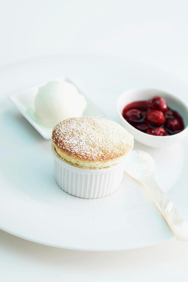 Banana Souffle With Ice Cream And Cherry Sauce Photograph by Michael Wissing