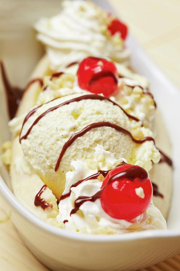 Banana Split With Vanilla Ice Cream, Banana, Chocolate Sauce, Cream And Cherries Photograph by Robert Kneschke