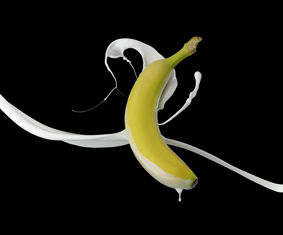 Banana With White Paint Splash On Black Photograph by Biwa Studio