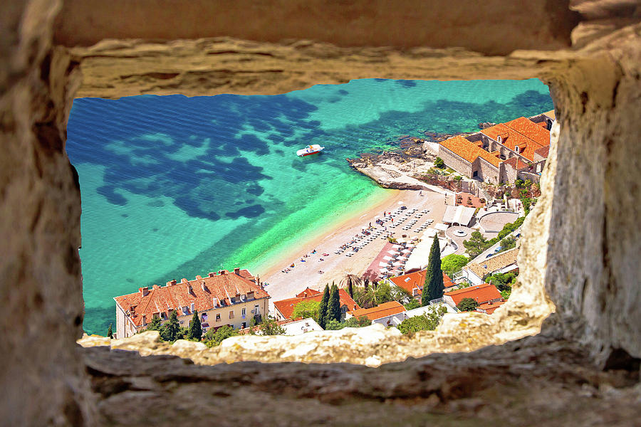 Banje beach in Dubrovnik aerial view through stone window Photograph by Brch Photography