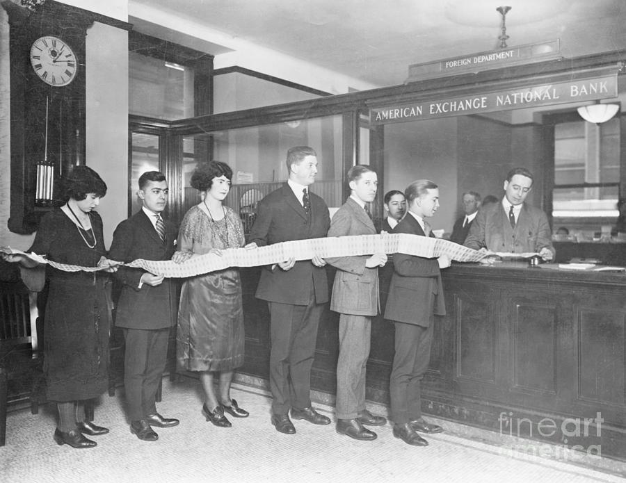 Bank Employees Holding Long Draft Tape Photograph by Bettmann
