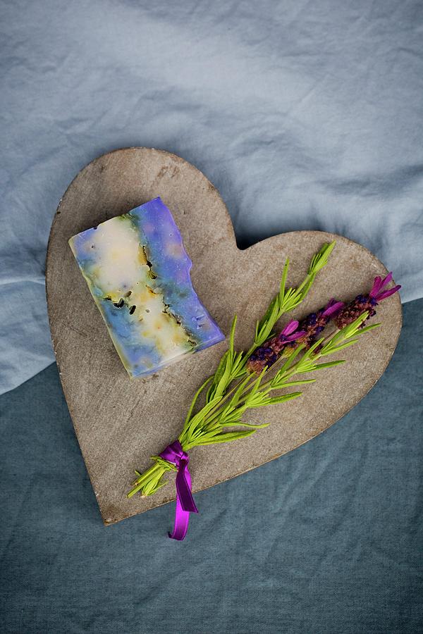 Bar Of Handmade Lavender Soap And Sprig Of Fresh Lavender On Wooden Heart Photograph by Esther Hildebrandt
