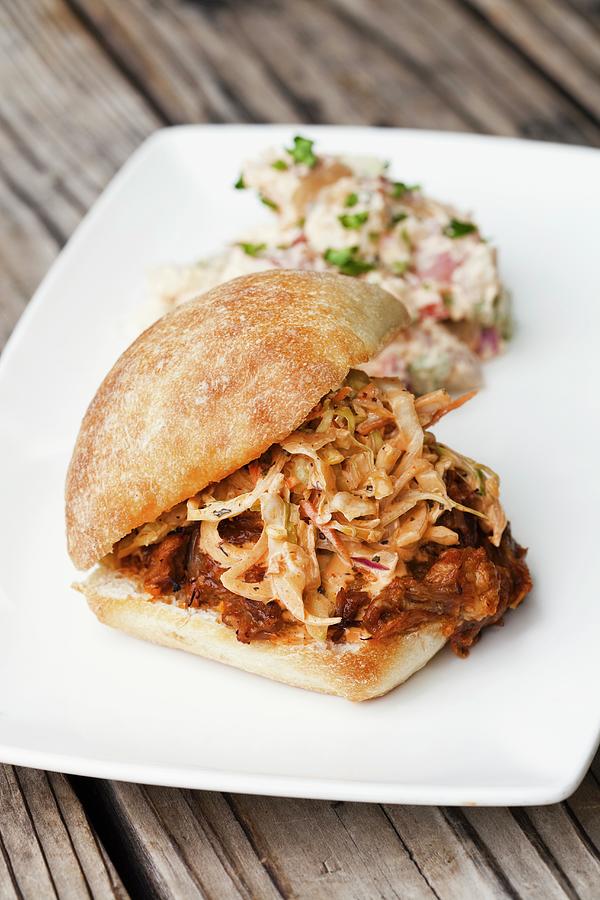 Barbecue Pulled Pork Sandwiches With A Side Of Coleslaw Photograph by Jennifer Martine