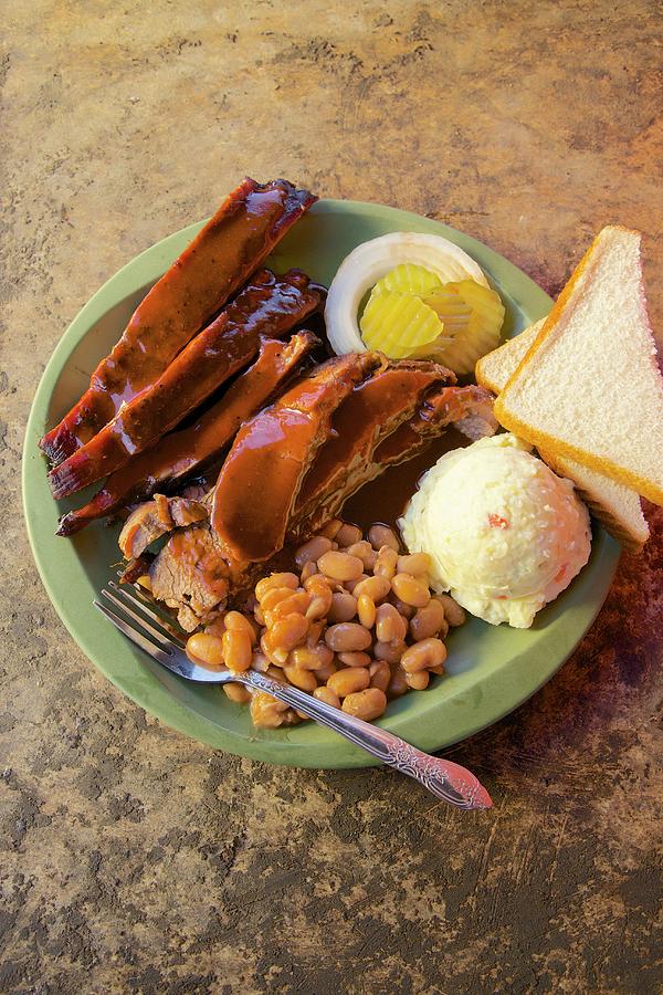 Barbecue Ribs With Beans, Mashed Poatoes, White Bread, Onion And Pickle Cucumber texas, Usa Photograph by Andre Baranowski