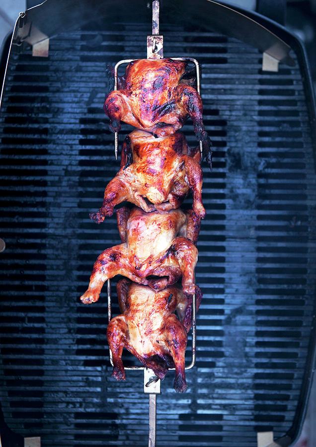 Barbecued Chicken On A Spit Above A Grill Photograph by Veslemy Vrskar