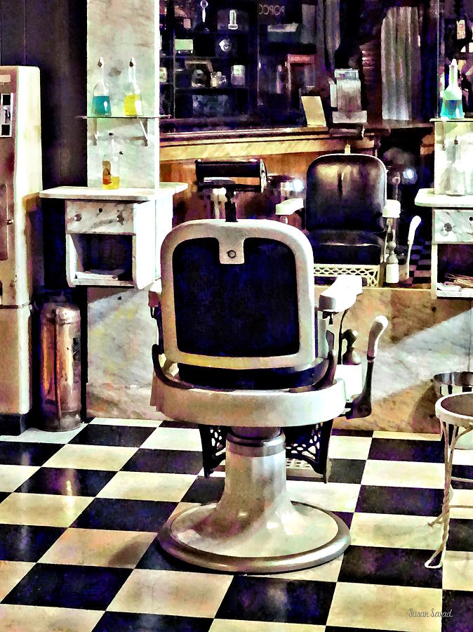 Barber Chair and Bottles of Hair Tonic Photograph by Susan Savad