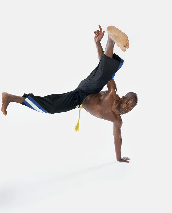 Bare Chested Man Break-dancing Photograph by Digital Vision