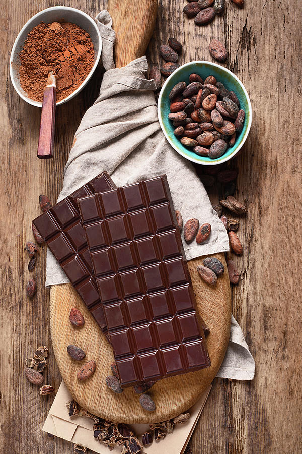 Bars Of Chocolate, Cacao Powder And Cacao Beans On Wooden Board Photograph by Tatjana Baibakova