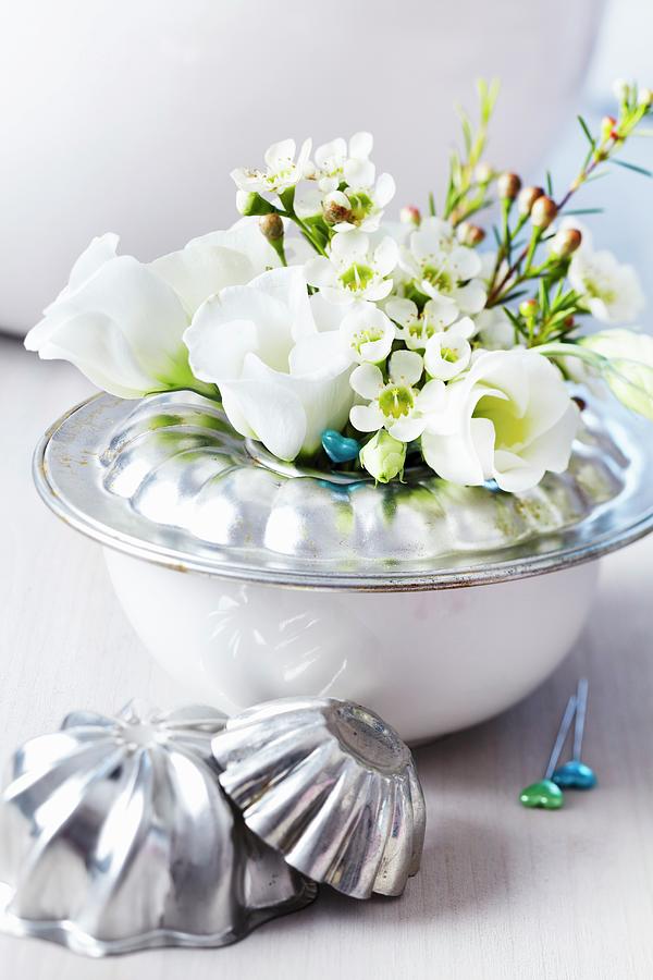 Base Of Bundt Tin On Bowl Used As Vase For Waxflowers & Lisianthus Photograph by Franziska Taube
