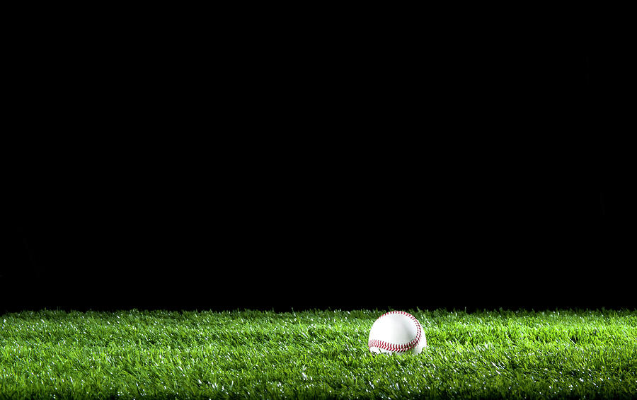 Softball Photograph - Baseball In The Grass At Night by Courtneyk